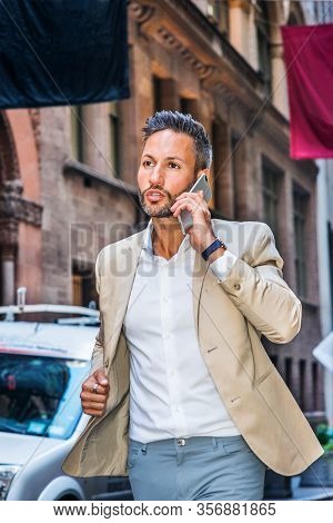 Young European Man With Beard, Little Gray Hair, Traveling In New York City, Wearing Beige Blazer, W