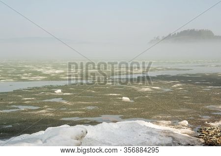 Morning Fog On The Lake, Sunrise, Lake In Ice, Ice Is Melting On The Lake