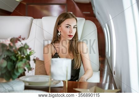 Beautiful Rich Woman In A Private First Class Plane.