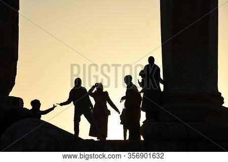 Amman, Jordan - February 15, 2020. Unidentified People At Sunset In Amman Citadel, Jordan. The Amman