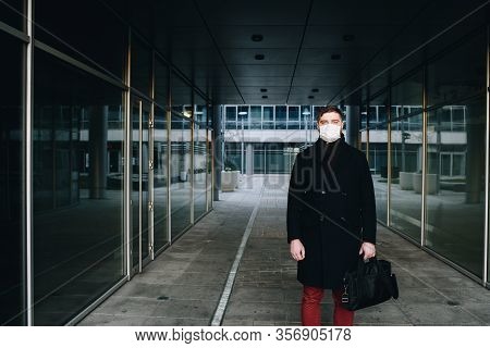 Caucasian Young Man Near His Office Wearing Surgical Face Mask To Protect From Coronavirus Covid-19