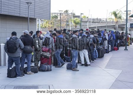 San Ysidro, California, Usa - March 20, 2020: Migrant Workers From Mexico Wait For Transportation To