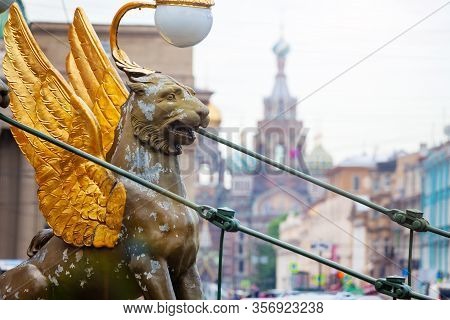 Griffin On Bank Bridge Crossing The Griboedov Canal With Savior On The Spilled Blood On Background I
