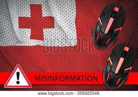 Tonga Flag And Two Computer Mouses. Misinformation During Coronavirus Or 2019-ncov Virus Concept