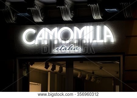 Palermo, Sicily - February 8, 2020: The Illuminated Logo Of The Camomilla Italia Boutique Which Sell