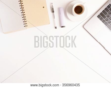 Flat Lay Composition With Laptop, Coffee, Pen And Notebook On White Desktop. Copyspace. Concept Remo