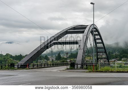 Bridge Steel Frame With Asphalt Road. River Bridge In Japanese Countryside. Kiso Valley, Japan