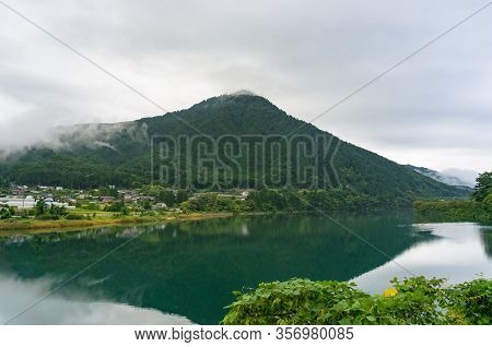 Japanese Countryside Landscape With Rural Village And River In The Mountains. Kiso Valley In Gifu, J