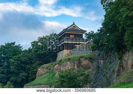 Traditional Japanese Castle On Stone Hill. Ueda Castle Historic Building In Nagano, Japan