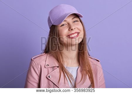 Close Up Portrait Of Charming Beautiful Young Female Smiling Sincerely, Being In Good Mood, Standing