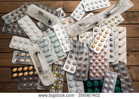 Closeup Shot Of Different Pills On Table With Tablets , Pharmaceutical Industry Concept