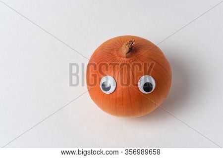 Napiform Onion With Googly Eyes On White Background Top View