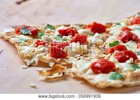 Traditional Tarte Flambee With Creme Fraiche, Tomato And Cheese