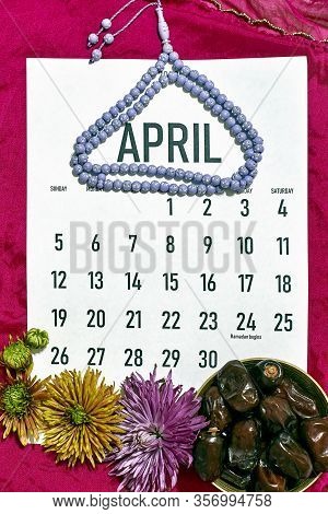 April Monthly Calendar On The Red Silk Textile Background. Islamic Ramadan Eid Festive Background Wi