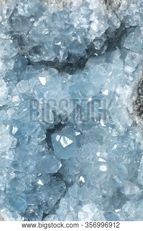 Sparkly Blue Celestite Geode Crystal Background Texture.