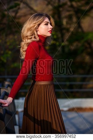 Feeling Free And Relaxed. Girl Long Blond Hair City Walk. Autumn Woman Curly Hair Outdoor. Haidresse