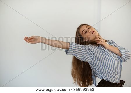Young Beautiful Girl Is Dancing In The Style Of Contemp.