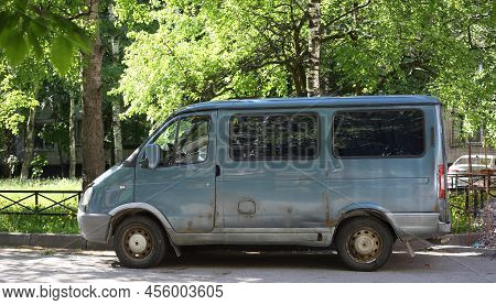 An Old Rusty Blue Minibus Parked In The Courtyard, Antonova-ovseenko Street, St. Petersburg, Russia,