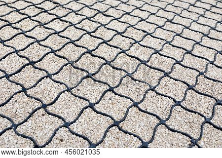 Geogrid Used At The Base Of A New Pedestrian Road, Road Construction, Reinforcement Covered With Fin