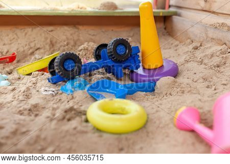 Sandbox Outdoor. Children\\\'s Wooden Sandbox With Various Toys For The Game. Summer Concept. Colore