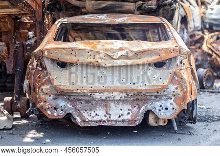 Russian Invasion Of Ukraine In 2022, Destroyed And Burned Cars. Cars Were Beaten With Shrapnel And B