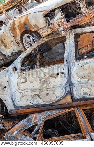 A View Of Burnt-out Cars After Rocket Attacks By The Russian Military. War Of Russia Against Ukraine