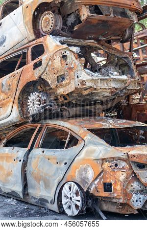 A View Of Burnt-out Cars After Rocket Attacks By The Russian Military. War Of Russia Against Ukraine
