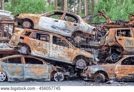 A View Of Burnt-out Cars After Rocket Attacks By The Russian Military. War Of Russia Against Ukraine