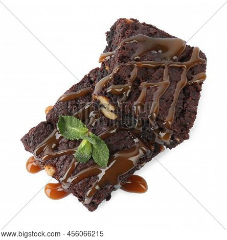 Delicious Chocolate Brownies With Nuts, Caramel Sauce And Fresh Mint On White Background, Top View
