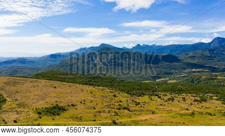Mountains Covered Rainforest, Trees And Blue Sky With Clouds. Riverston, Sri Lanka.