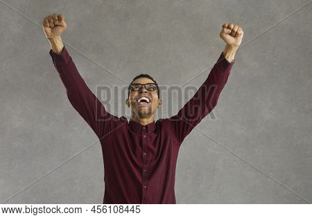 African American Man Clench Fist Standing With Raised Hands Up Celebrating Win