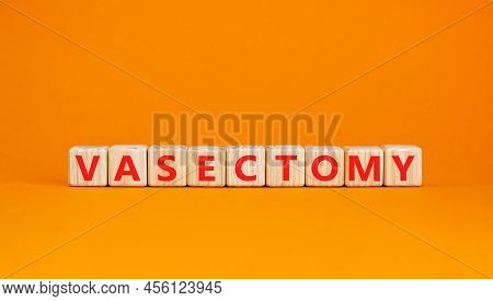 Vasectomy Symbol. Concept Words Vasectomy On Wooden Blocks. Beautiful Orange Table Orange Background