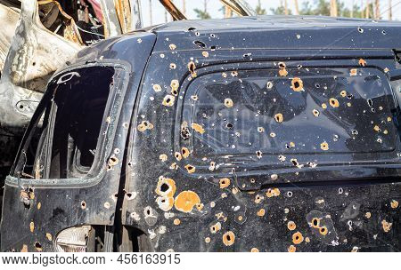 Shot, Damaged Cars During The War In Ukraine. The Vehicle Of Civilians Affected By The Hands Of The