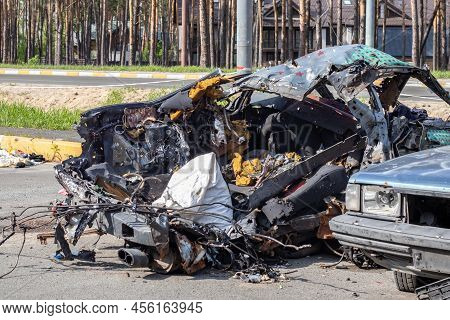 Shot, Damaged Cars During The War In Ukraine. The Vehicle Of Civilians Affected By The Hands Of The