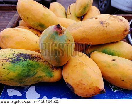Fresh Yellow And Green Mangos From The Market