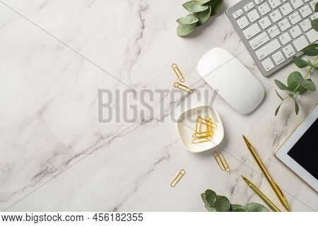 Business Concept. Top View Photo Of Workspace White Keyboard Tablet Computer Stationery Gold Pens Cl