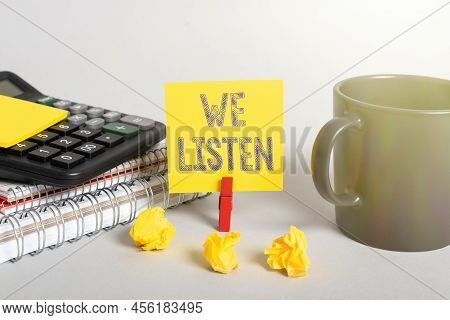 Text Caption Presenting We Listen. Internet Concept Group Of Showing That Is Willing To Hear Anythin