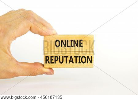 Online Reputation Symbol. Wooden Blocks With Concept Words Online Reputation On Beautiful White Back