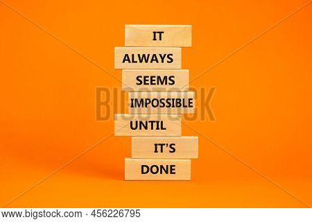 Possible Or Impossible Symbol. Wooden Blocks With Words It Always Seems Impossible Until It Is Done.