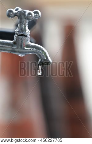 Faucet Dripping Water Drop