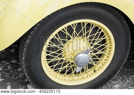 Wheel Of A Non-modern Carwheel With Yellow Spokes Of A Non-modern Car, Horizontal Format