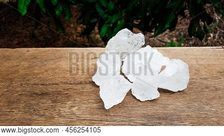 White Clear Alum Cubes On Brown Woodplank Concept For Beauty And Medical Industrial.