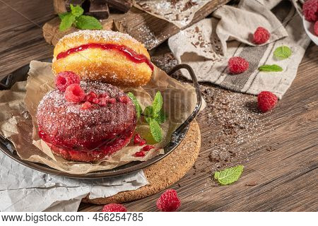 Bolas De Berlim, Or Berlin Balls. Portuguese Fried Dough With Sugar, Filled With Chocolate Or Raspbe