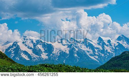 Idyllic Landscape With Blue Sky, Green Grassland And Snowcapped Mountain Top. Svanetia Region, Georg