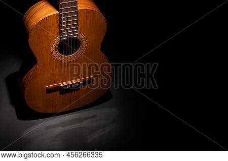 Classical Guitar Body Up Close On A Plain Background With Negative Space For Copy