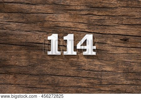 Number 114 In Wood, Isolated On Rustic Background