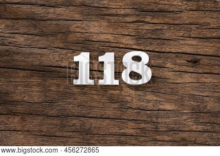 Number 118 In Wood, Isolated On Rustic Background