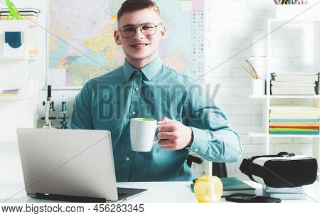 Happy Handsome Student In Spectacles Having An Exelent Mark For Exam. Portrait Of Happy Male Student