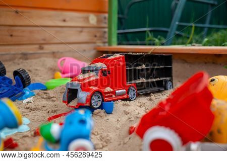 Sandbox Outdoor. Children's Wooden Sandbox With Various Toys For The Game. Summer Concept. Colored T