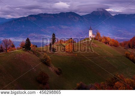 Autumn Red Sunset Panorama With Saints Primus And Felician Church On Top Of Hill In Jamnik, Slovenia